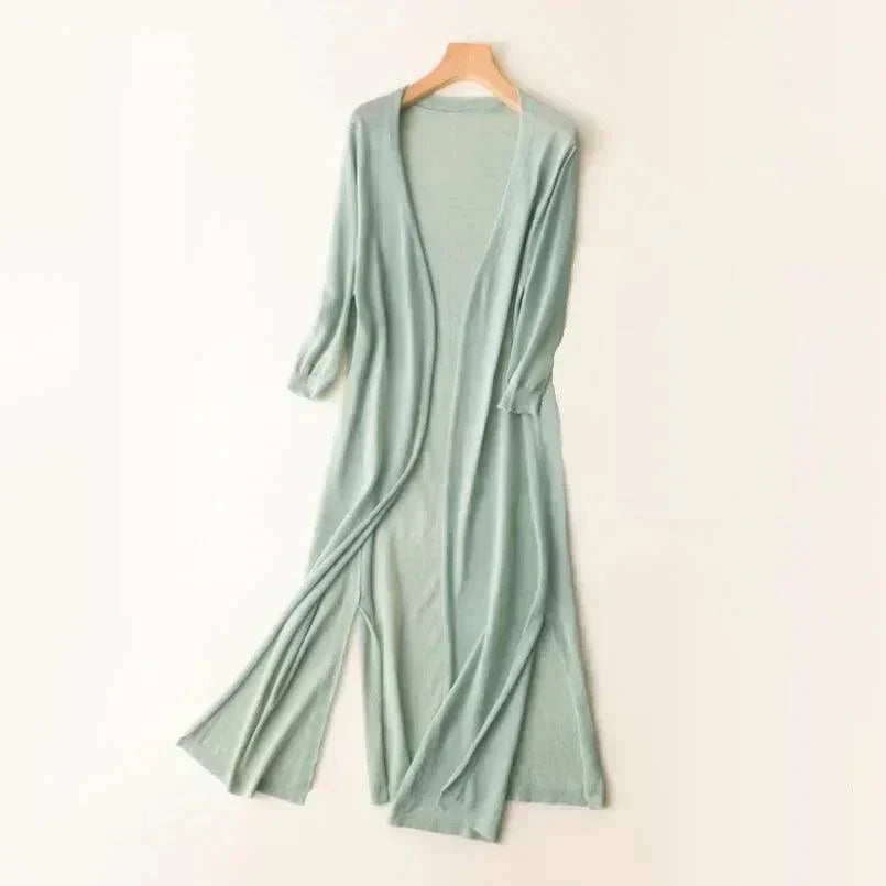 Versatile women's long vest, a lightweight sleeveless cardigan. Great layering piece for casual or elegant transitional outfits.