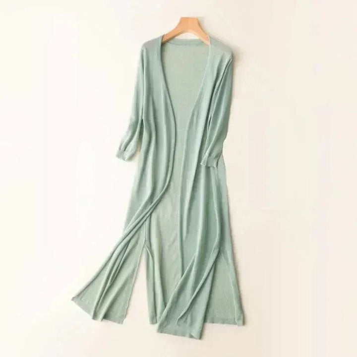 Versatile women's long vest, a lightweight sleeveless cardigan. Great layering piece for casual or elegant transitional outfits.