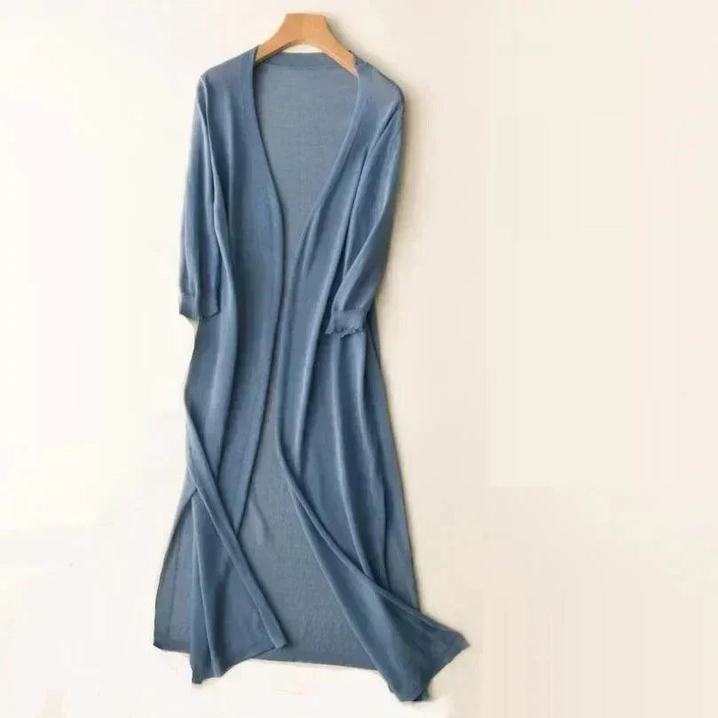 Modern women's long vest, a chic lightweight outerwear piece. Sleeveless cardigan for a stylish and versatile layering option.