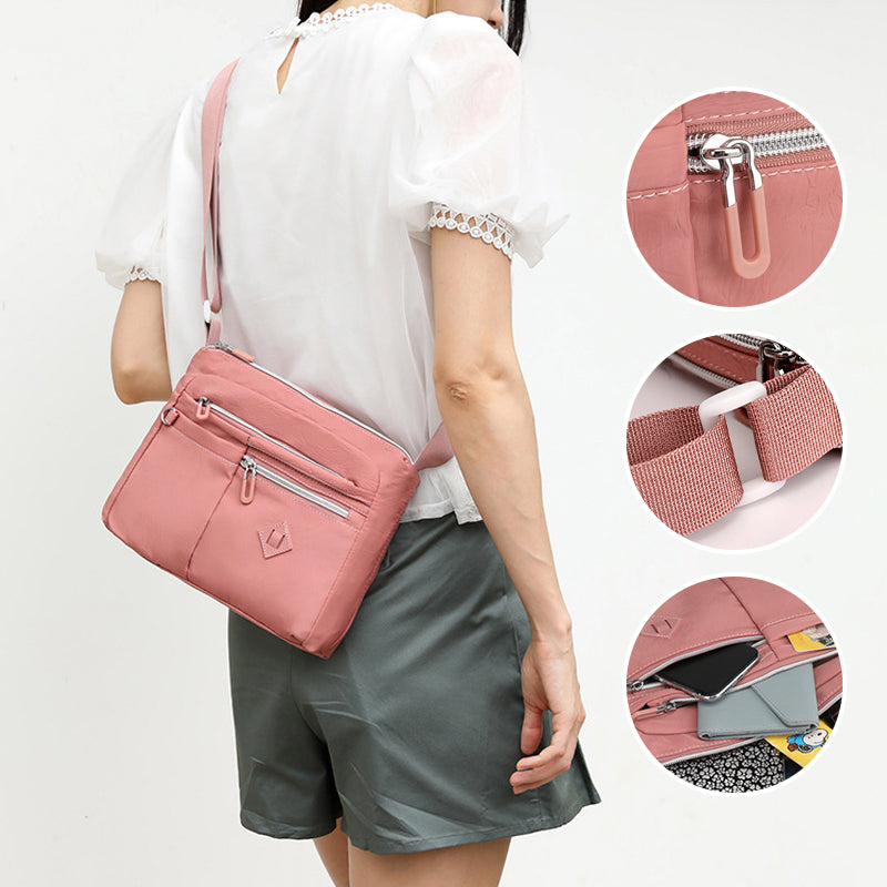 Detail of the durable zipper on the women's nylon travel bag, ensuring security