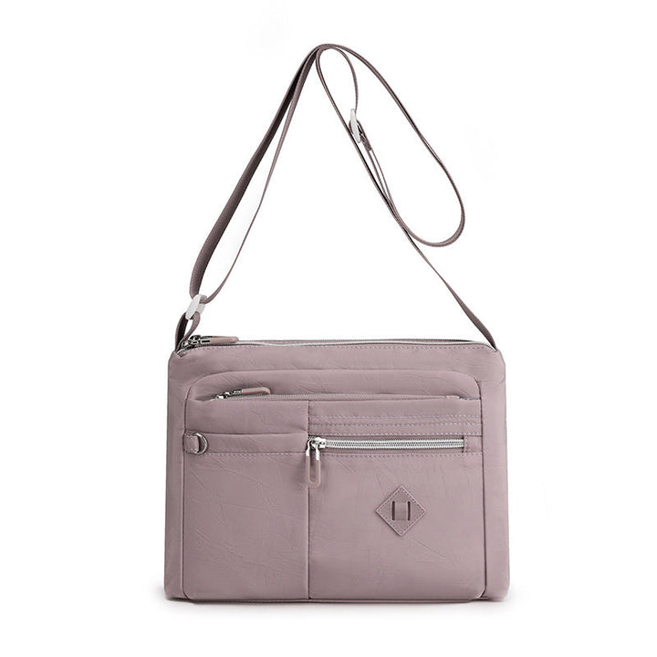 Women's lightweight shoulder bag in navy blue, offering style and functionality