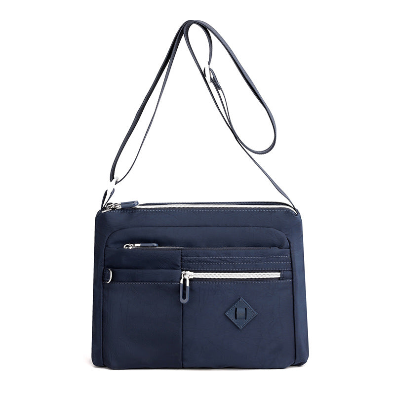 Angled shot of the women's waterproof shoulder bag, highlighting its spacious interior