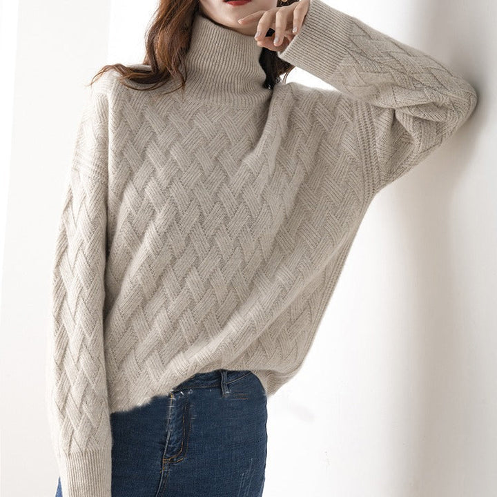 Elegant women's black knit turtleneck sweater with long sleeves, ideal for versatile spring fashion.