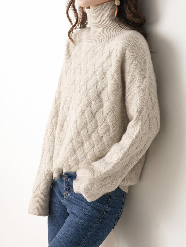 Woman wearing a stylish navy blue turtleneck sweater, a comfortable and elegant spring layering top.
