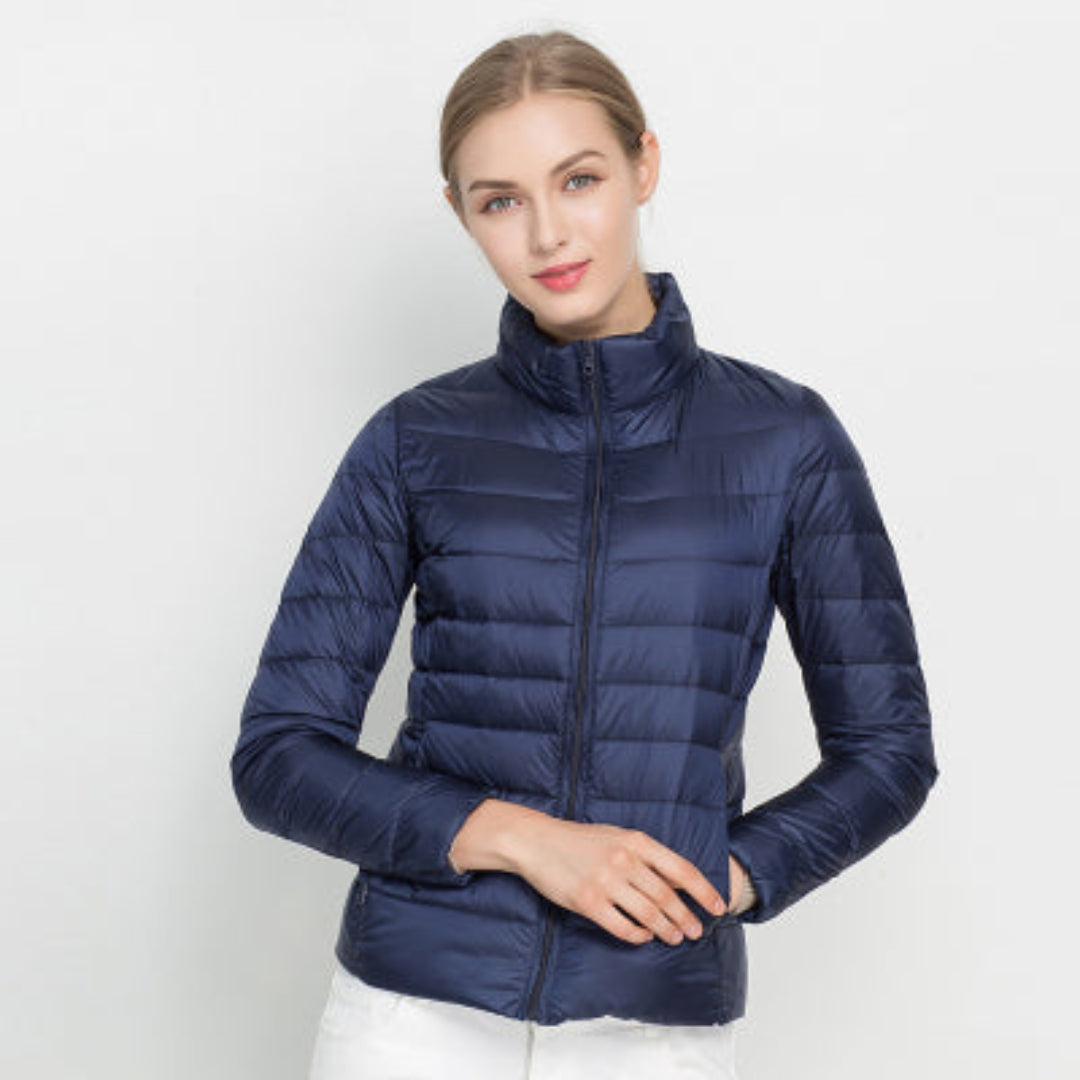 Ultra-lightweight and warm women's puffer jacket, easily packable for travel, perfect winter outerwear.