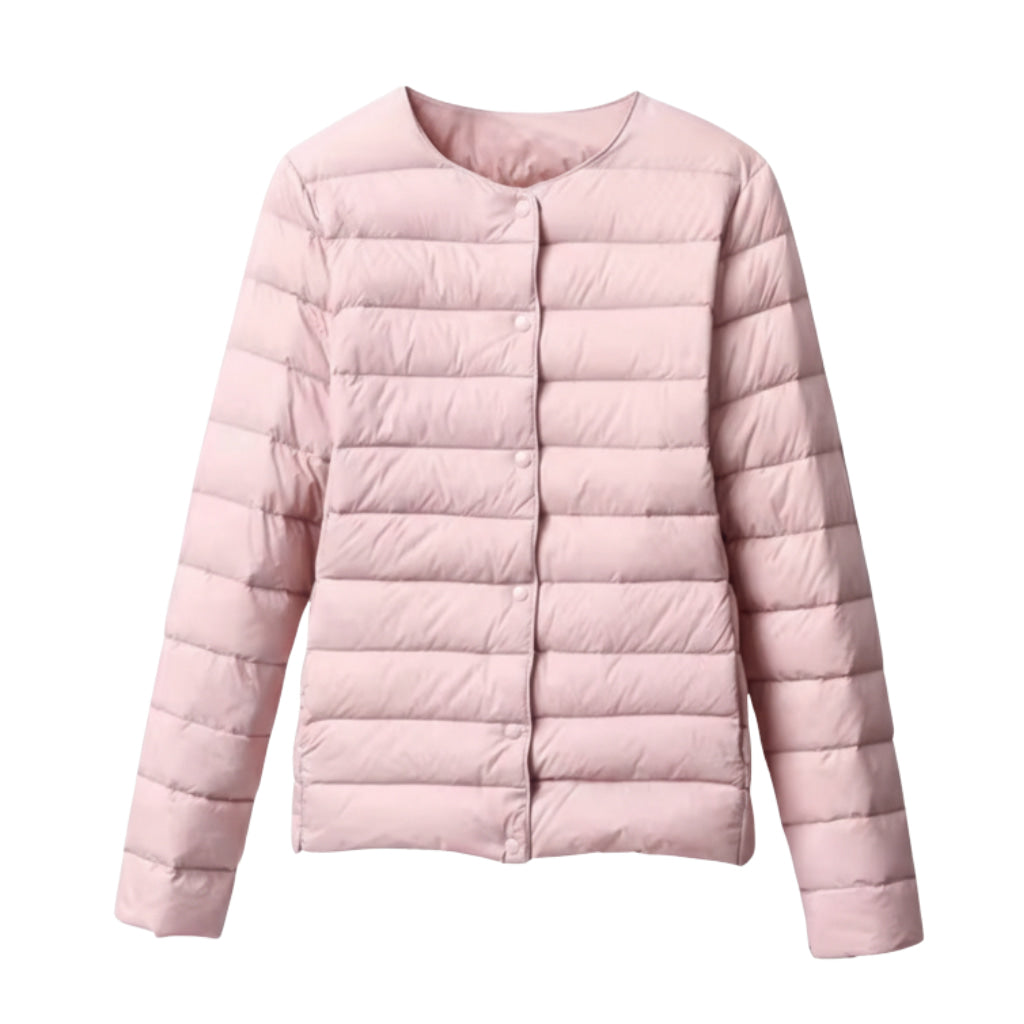 Woman smiling, wearing a stylish and lightweight quilted puffer jacket for spring fashion.