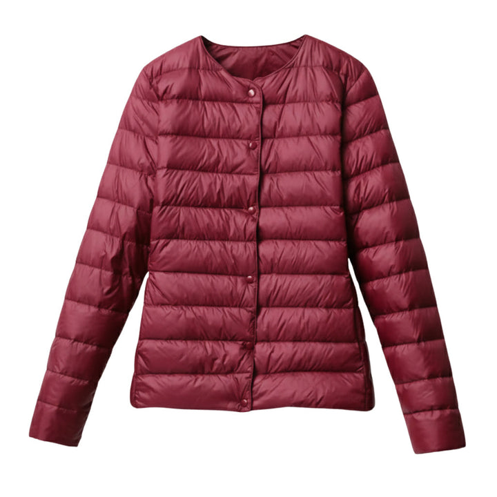 Model posing in a versatile women's lightweight puffer, ideal as a seasonal fashion jacket.