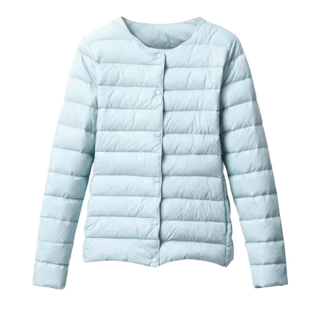 Full-body shot of a woman in a casual, quilted puffer jacket, perfect for spring layering.
