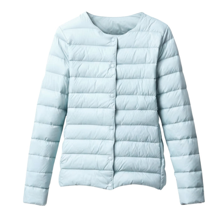 Full-body shot of a woman in a casual, quilted puffer jacket, perfect for spring layering.