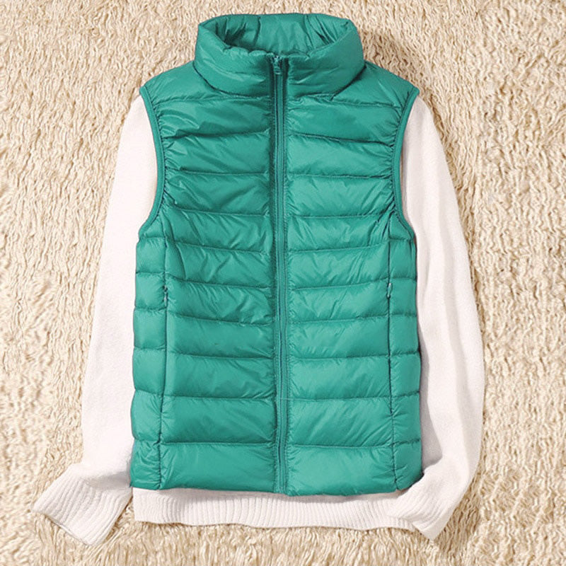 Lightweight zip vest for women, featuring a chic quilted design. Ideal for transitional seasons.