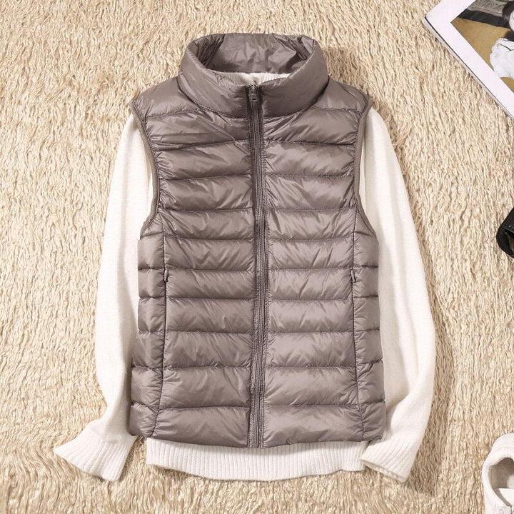 Feminine fit quilted vest for women, a comfortable and stylish outerwear layering piece.