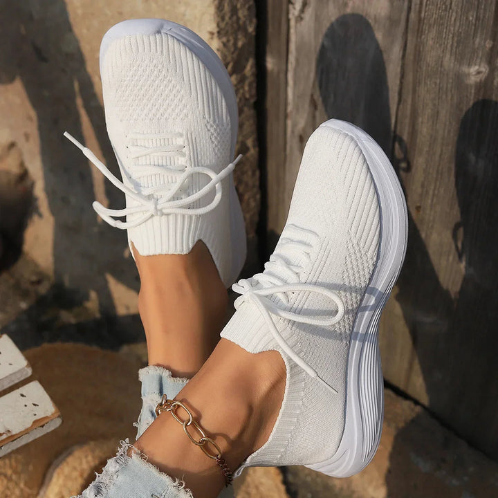 Modern women's ribbed lace-up sneakers. Versatile, minimalist design for fashion-forward everyday wear.