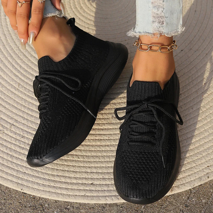 Women's comfortable walking shoes. Lightweight ribbed casual sneakers with lace-up for all-day support.