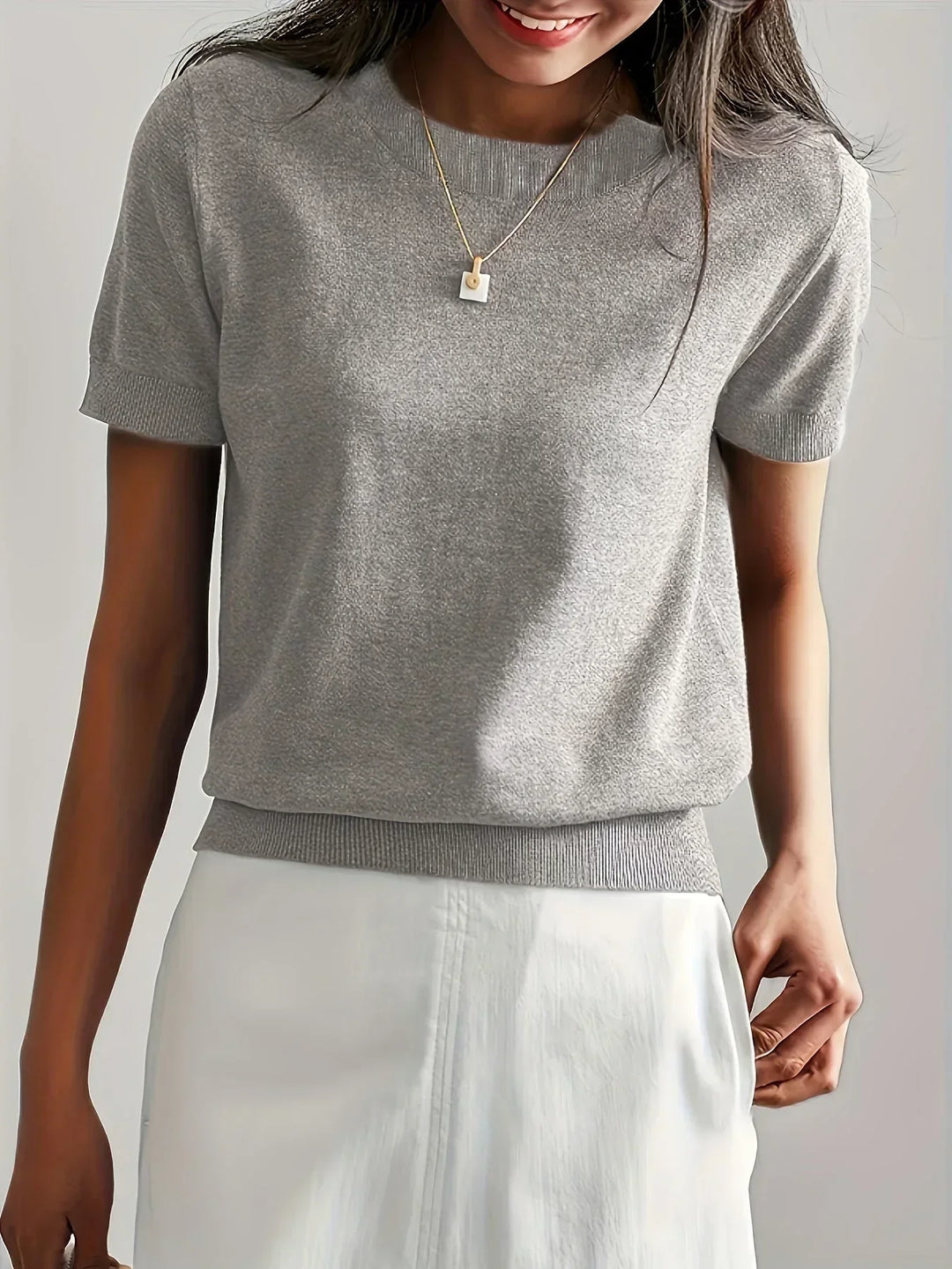 Women's short sleeve lightweight sweater, a breathable pullover for spring & summer fashion.