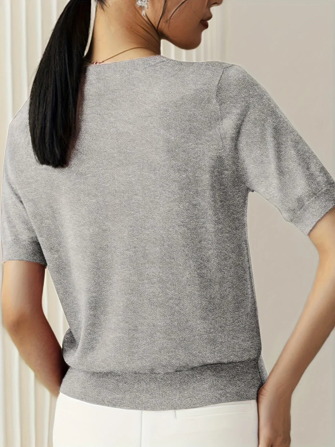 Casual knit short sleeve top for women, lightweight and versatile for spring/summer wear.