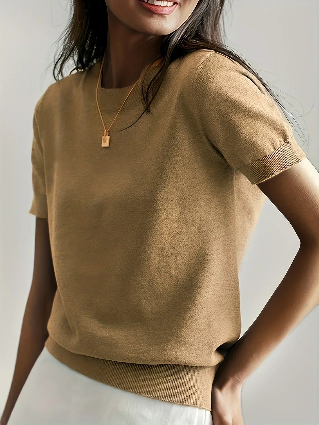 Soft, breathable short sleeve women's sweater, perfect lightweight comfort wear for spring/summer.