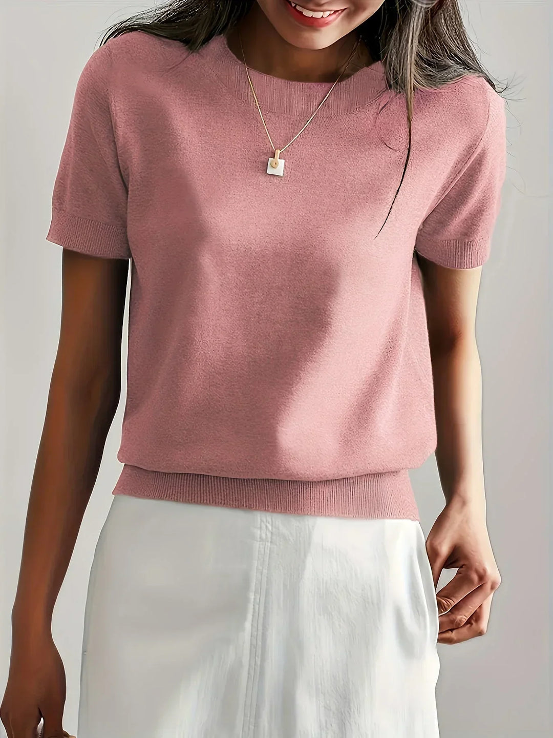Simple yet chic short sleeve women's sweater, lightweight breathable knit for spring/summer fashion.