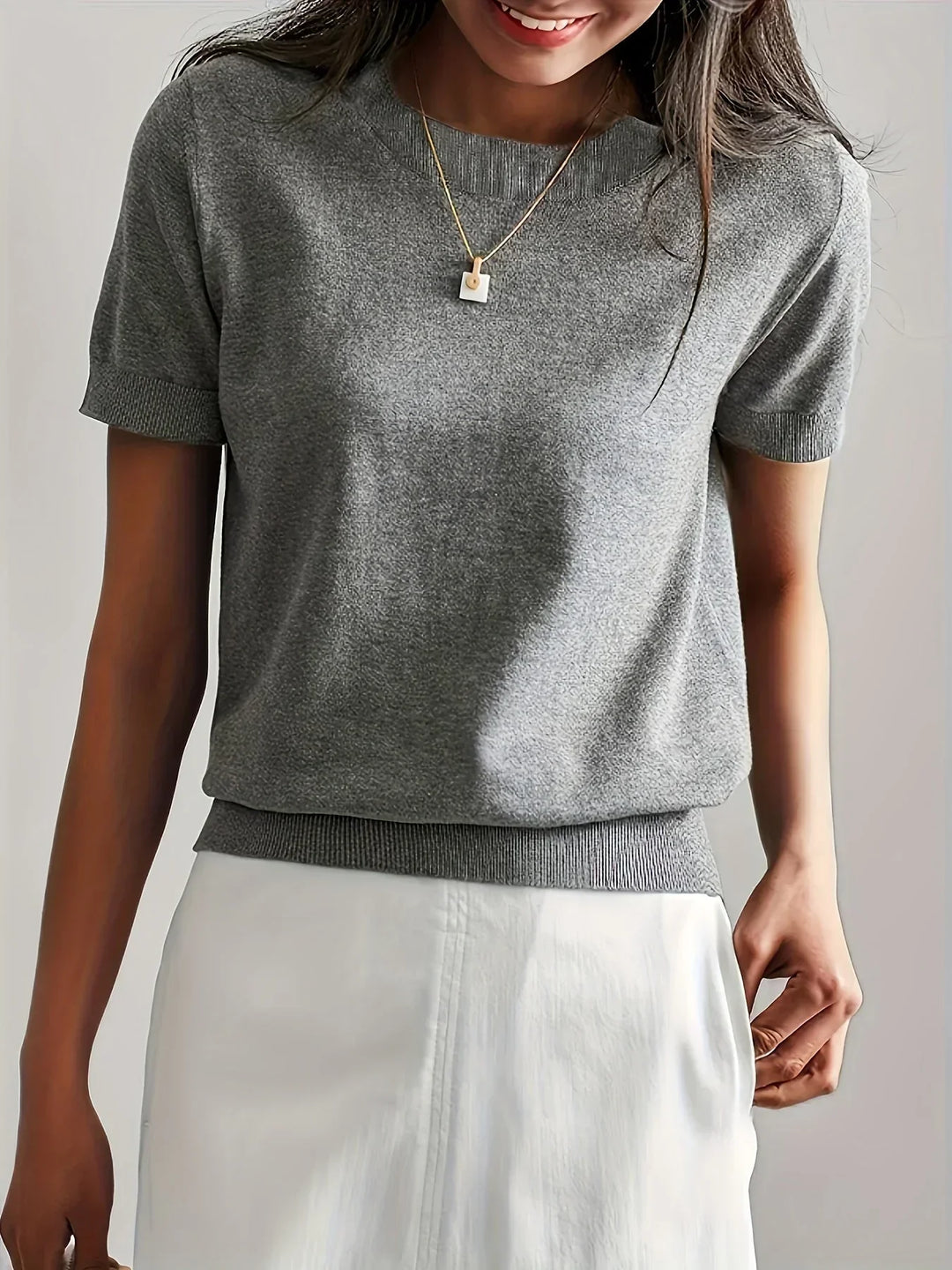 Breathable, lightweight short sleeve knit sweater for women, ideal comfort wear.