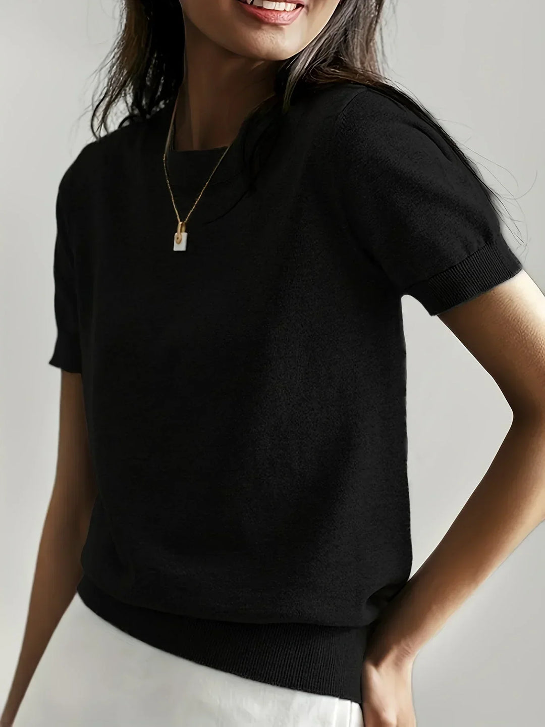 Women's short sleeve pullover sweater, lightweight & breathable for everyday spring/summer wear.