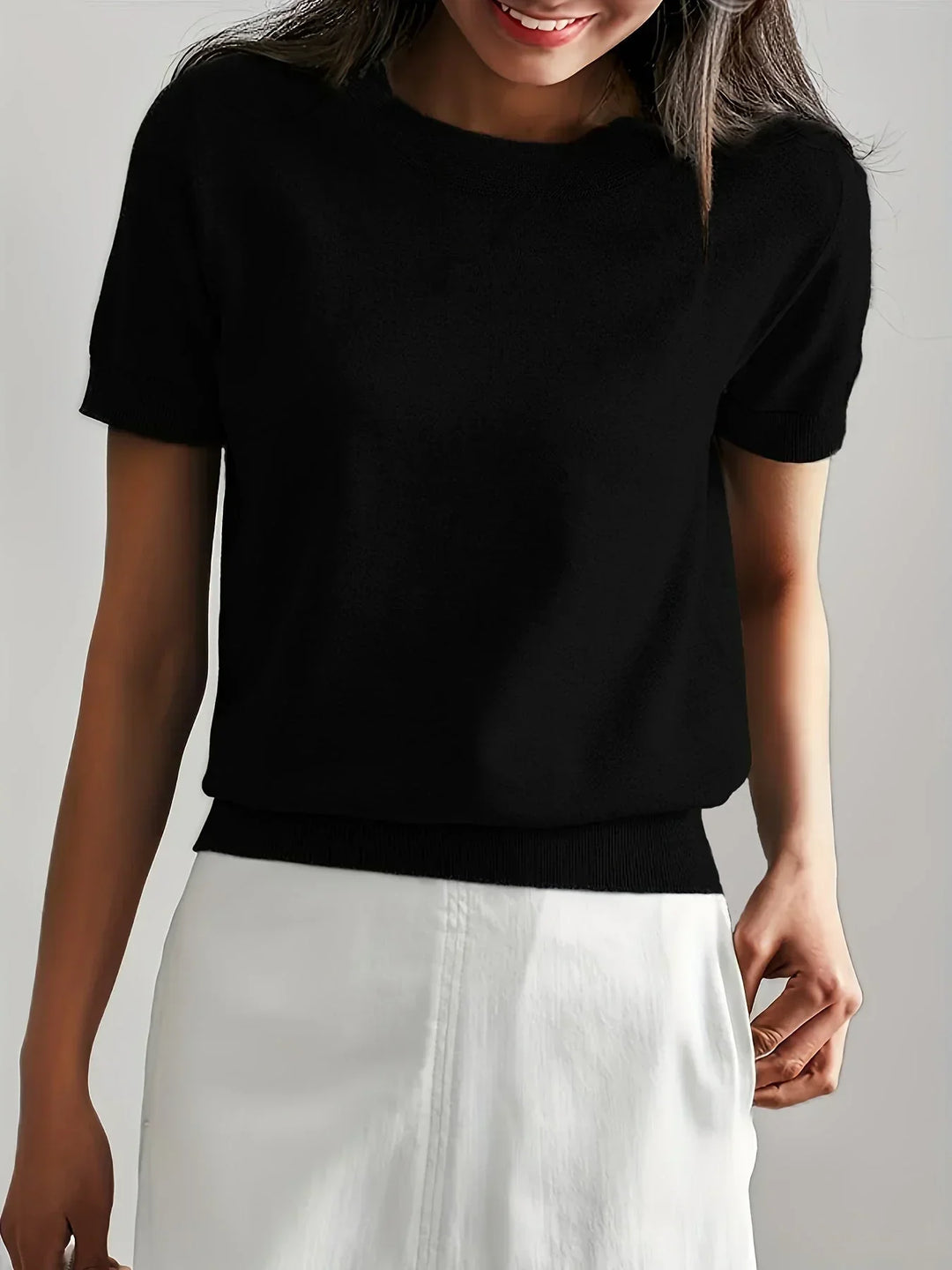 Versatile short sleeve women's sweater, a staple for spring fashion and summer comfort.
