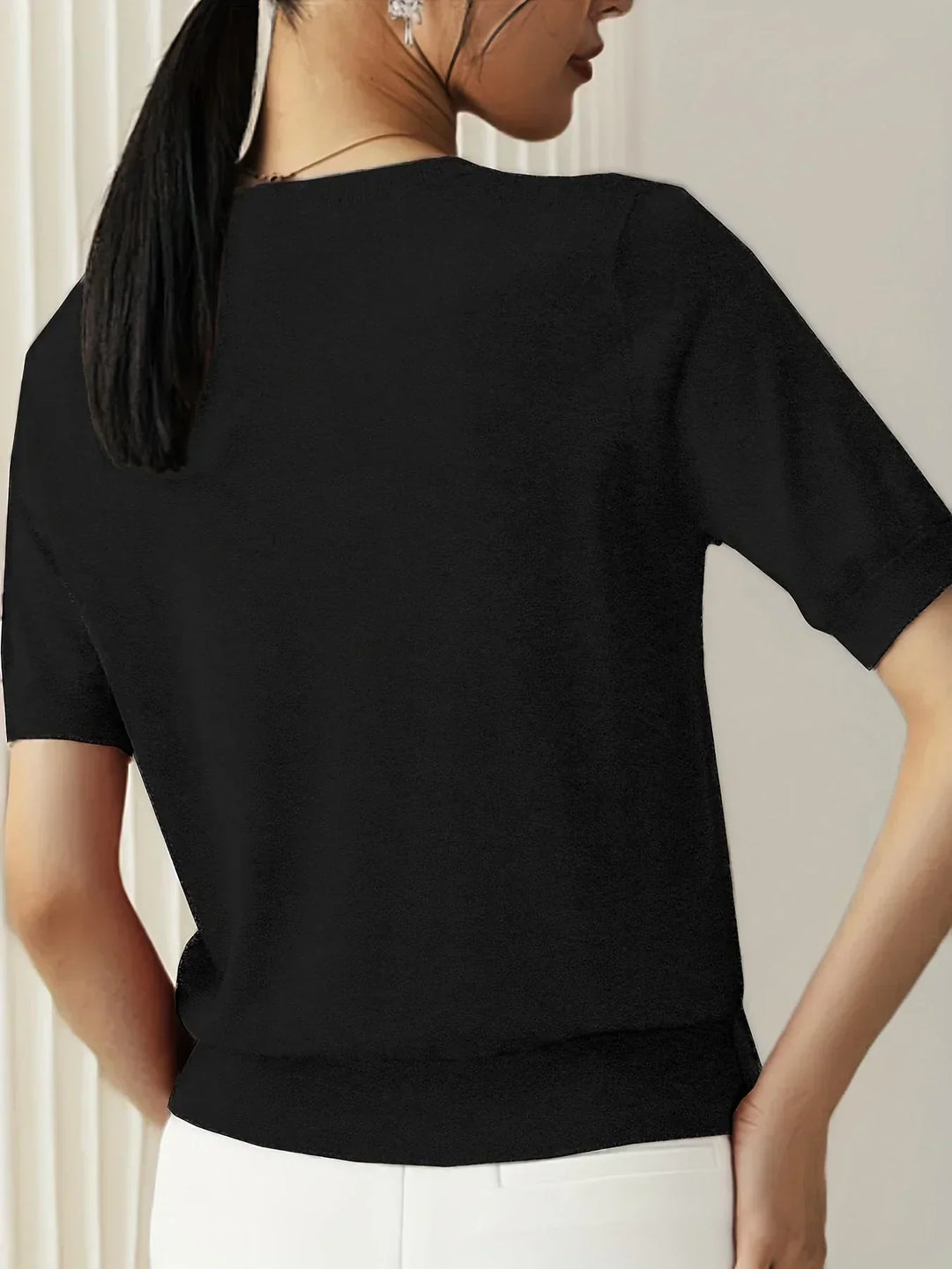 Loose fit short sleeve knit top, lightweight and breathable for women's spring/summer style.