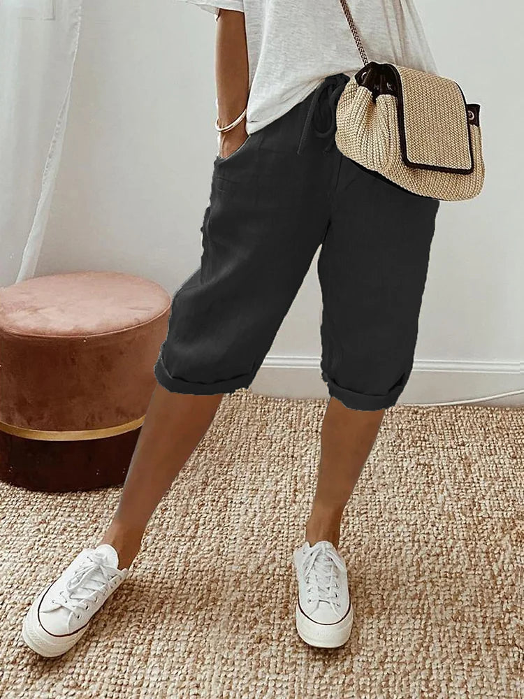 Women's lightweight summer comfort shorts with drawstring waist & pockets, ideal for warm weather casual wear.