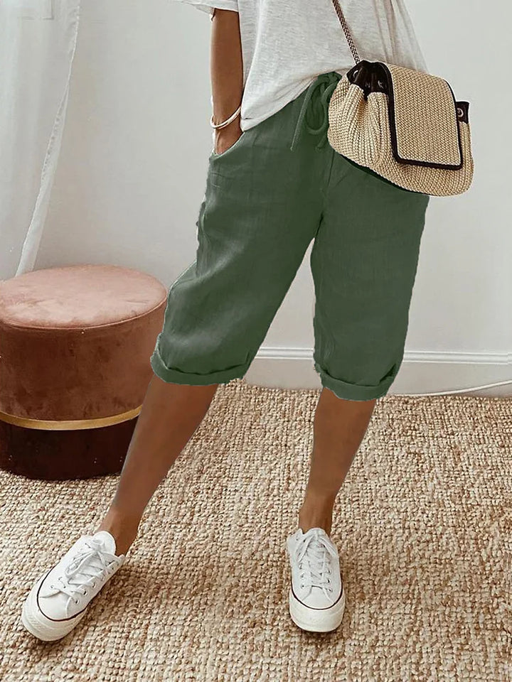 Women's comfortable summer shorts featuring a drawstring waist, pockets, and lightweight fabric for warm weather.