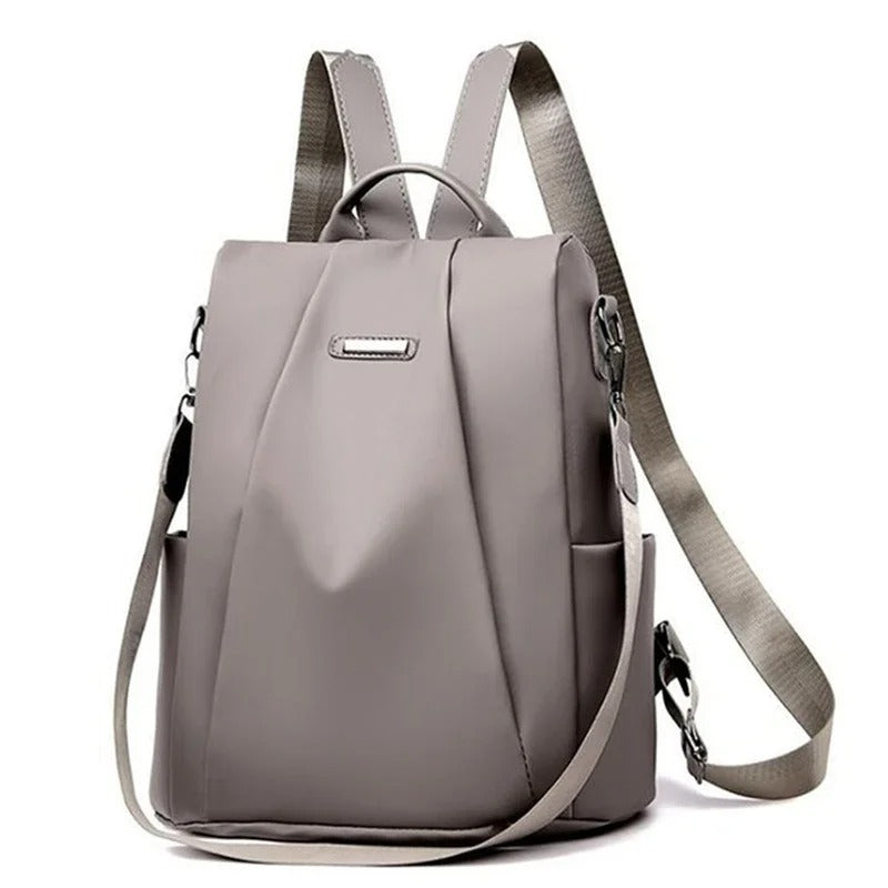 Stylish multi-way nylon bag for women: wear as a backpack, crossbody, or shoulder bag. Water-resistant.
