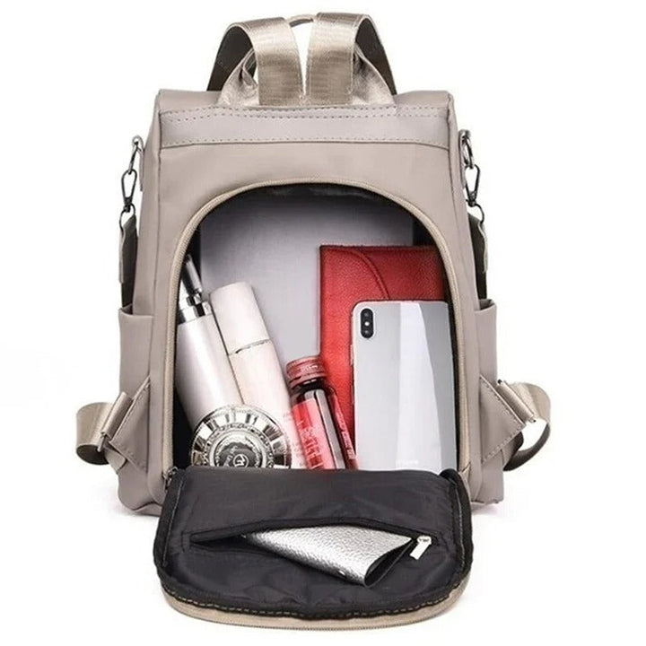 Durable water-resistant nylon backpack for women, ideal for daily commute. Lightweight & versatile design.