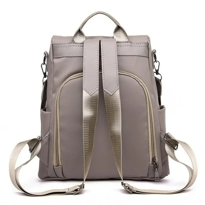 Fashionable women's lightweight nylon travel backpack. Offers multi-way carry: shoulder, crossbody, or back.