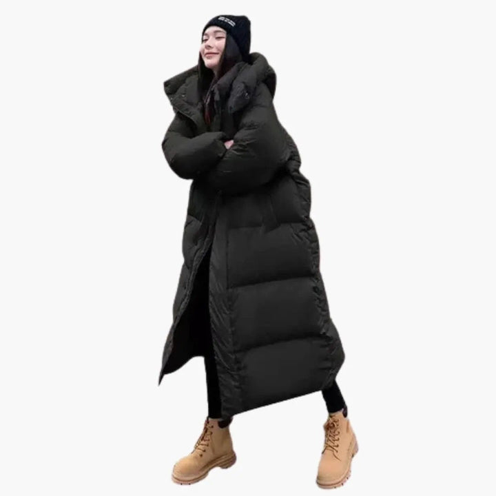 Fashionable women's quilted long puffer coat with hood, ideal for stylish and warm winter outerwear.