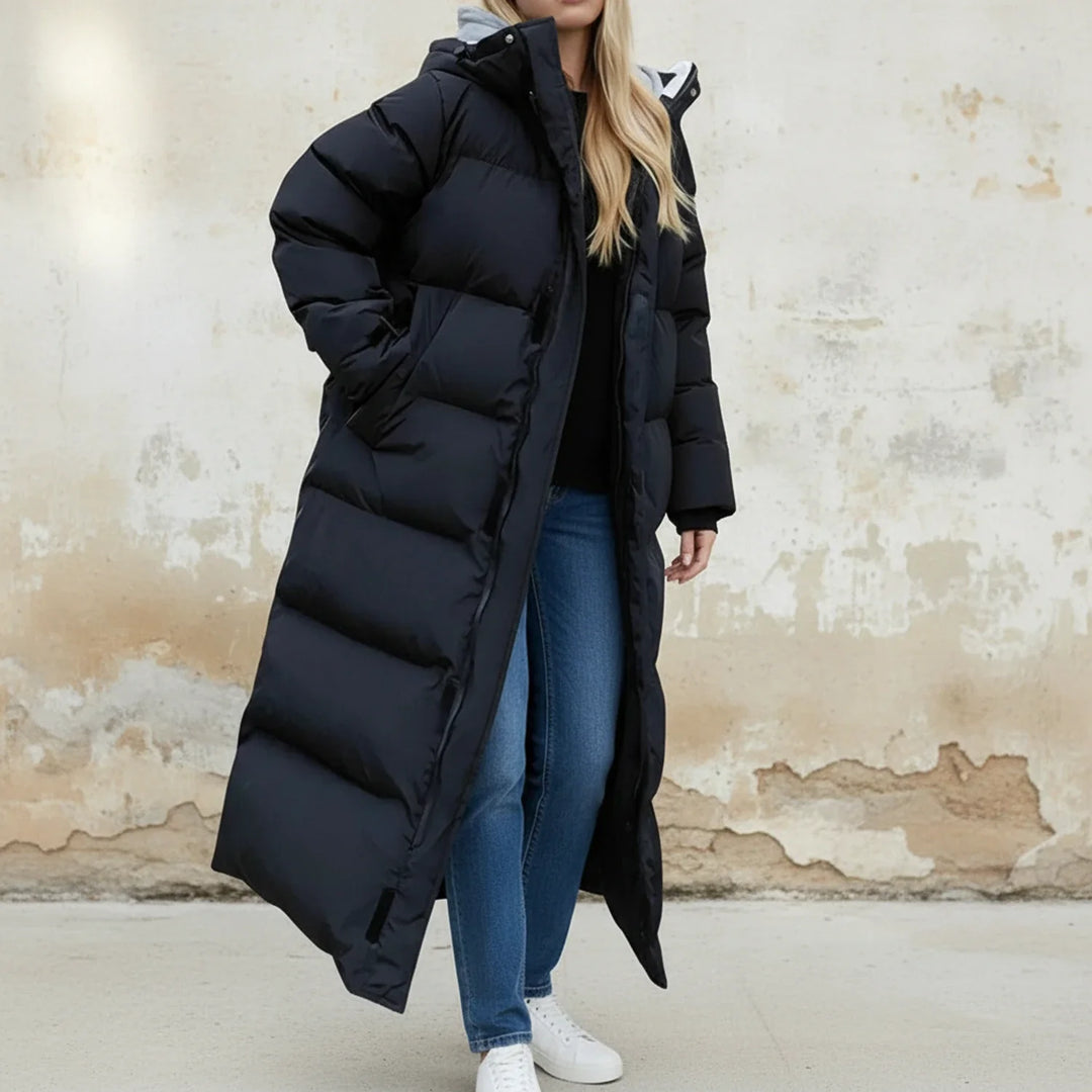 Women's long black puffer winter jacket with hood for ultimate warmth. Insulated cold weather outerwear for women.