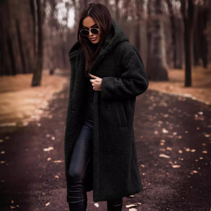 Women's long hooded teddy coat in a soft fabric, perfect for winter warmth and cozy style.