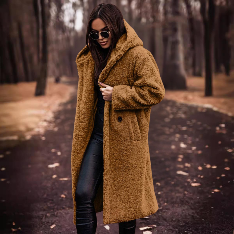 Warm women's long hooded teddy coat, a versatile outerwear piece for stylish comfort during fall and winter.
