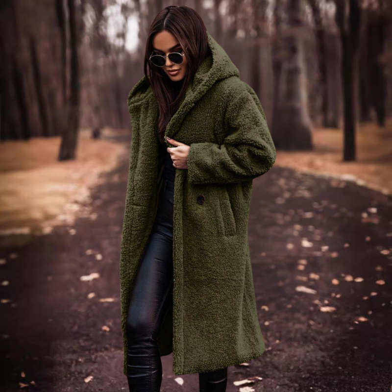 Trendy women's long teddy bear coat with hood, offering modern style and essential warmth for cold winters.