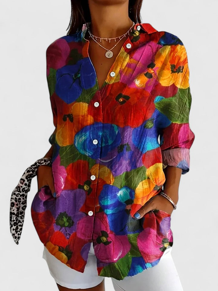 Vibrant women's floral abstract print blouse with front buttons & collar. Long sleeve, casual spring wear.