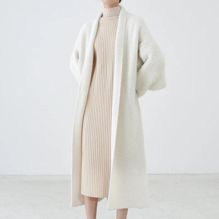 Women's longline open front cardigan in a light, flowing fabric, perfect for spring layering.