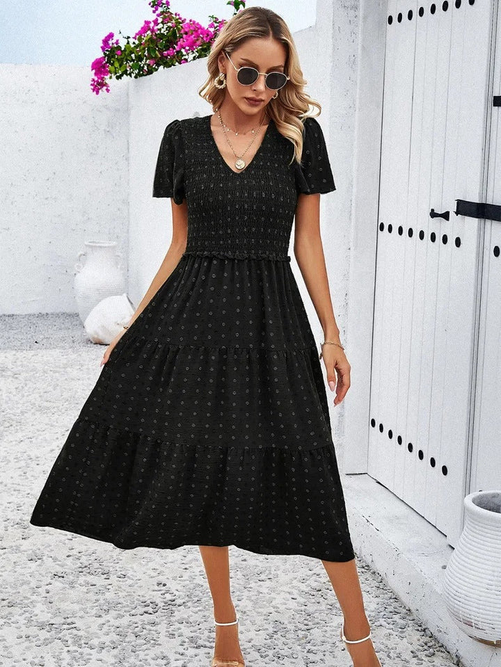 Black loose fit women's midi dress, comfortable & stylish for autumn casual wear.