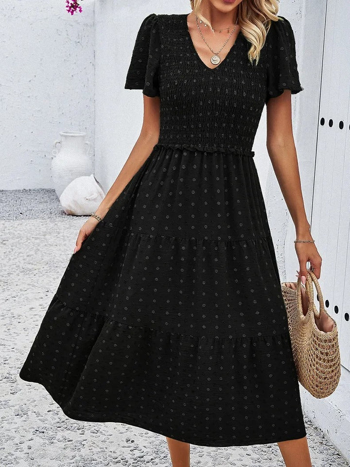 Stylish black loose fit dress, women's midi for fall, comfortable & casual wear.