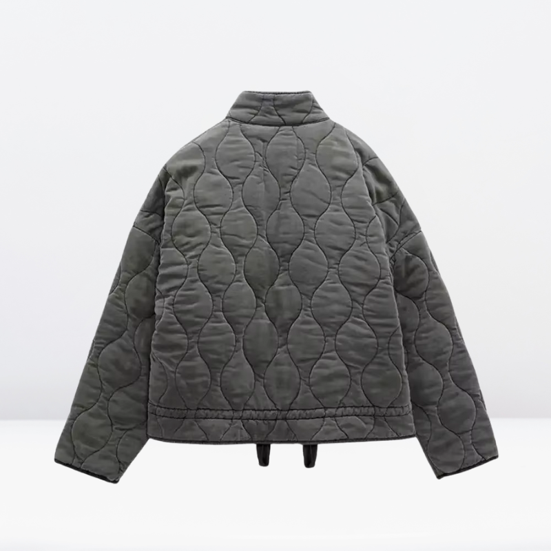 Gray women's quilted jacket with adjustable drawstring & zipper. Warm, casual fall/winter outerwear for women.