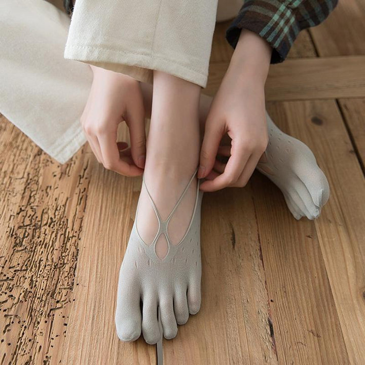 Assortment of women's low-cut toe socks in various colors, made from a premium cotton blend.