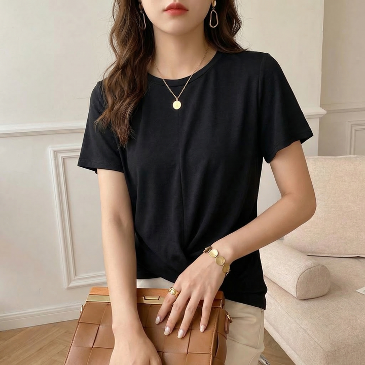 Fashionable women's short-sleeve t-shirt with a unique twist front design. The Luna top offers effortless style.