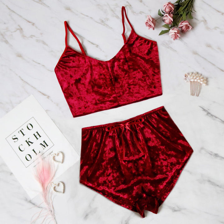 Close-up of the delicate lace trim on a pink velvet V-neck cami shorts lingerie set