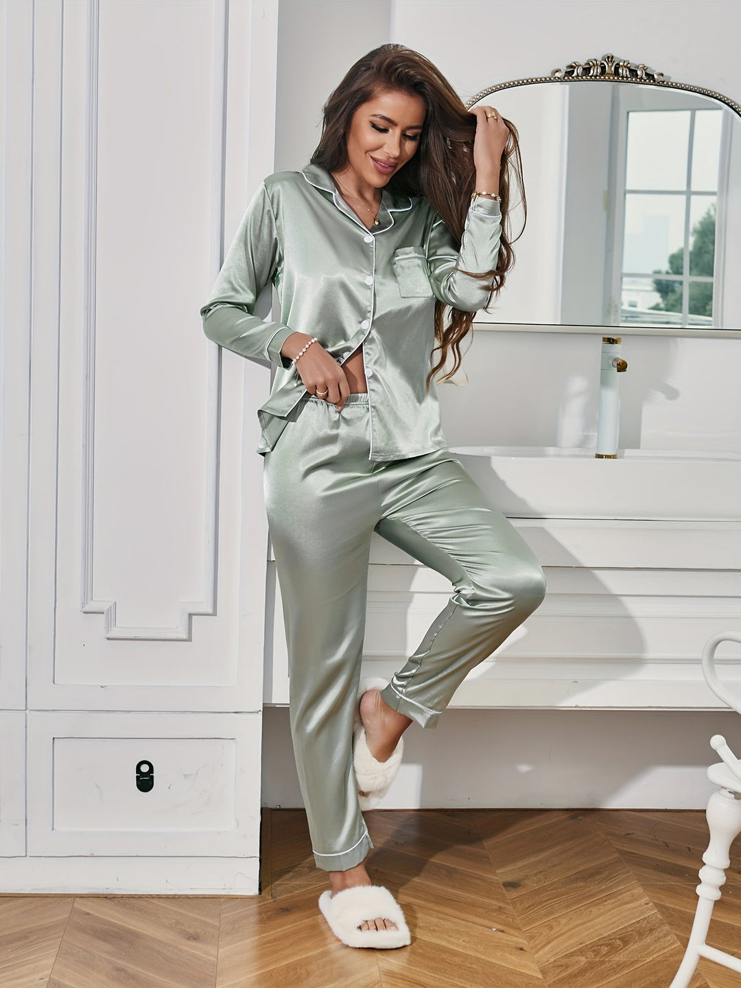 Close-up of the smooth, luxurious silky fabric of a women's two-piece pajama set for ultimate comfort.