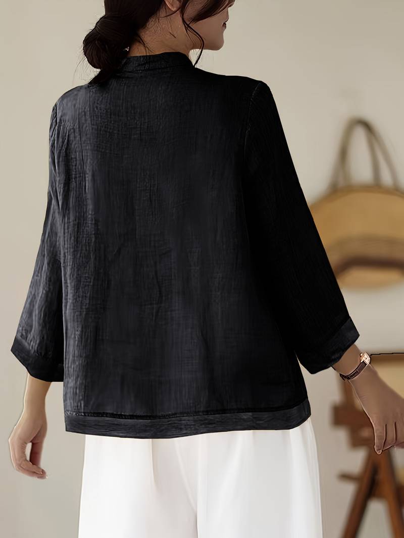 Versatile women's mandarin collar blouse, frog buttons, suitable for office & casual outfits.
