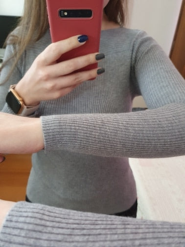 Women's elegant slim fit knitted pullover with boat neckline, ideal for a smart casual or professional outfit.