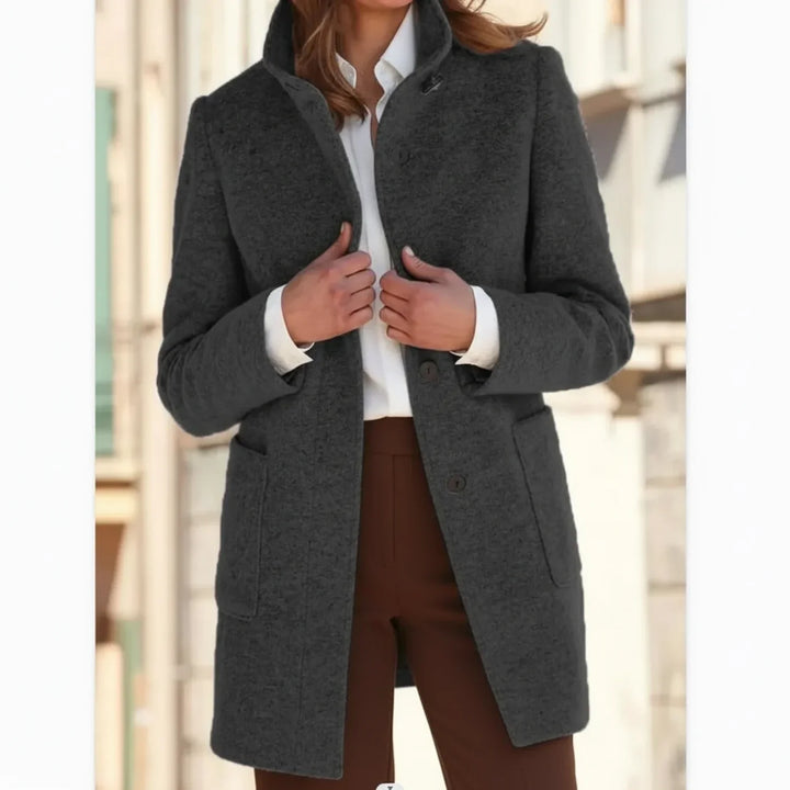Stylish women's mid-length fall coat. Warm outerwear, perfect for winter and casual elegant fashion.