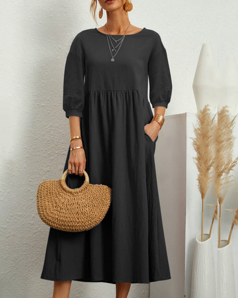 Trendy women's midi dress, ideal for spring/autumn, with a round neck and comfortable lantern sleeves.