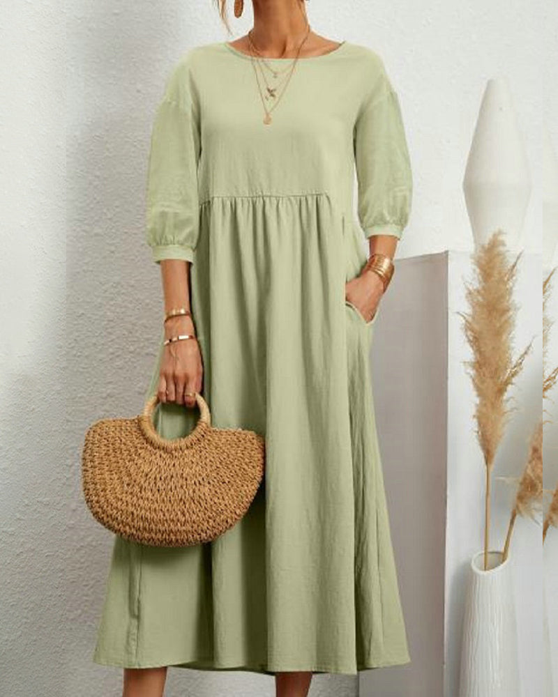 Women's midi dress for a loose, comfortable fit, featuring a round neckline and fashionable lantern sleeves.