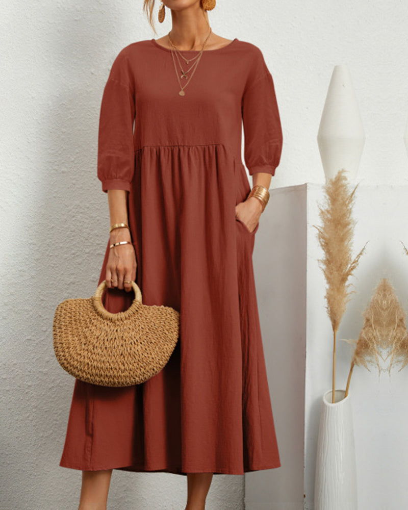 Versatile women's midi dress with a comfortable loose fit, round neckline, and flowing lantern sleeves.